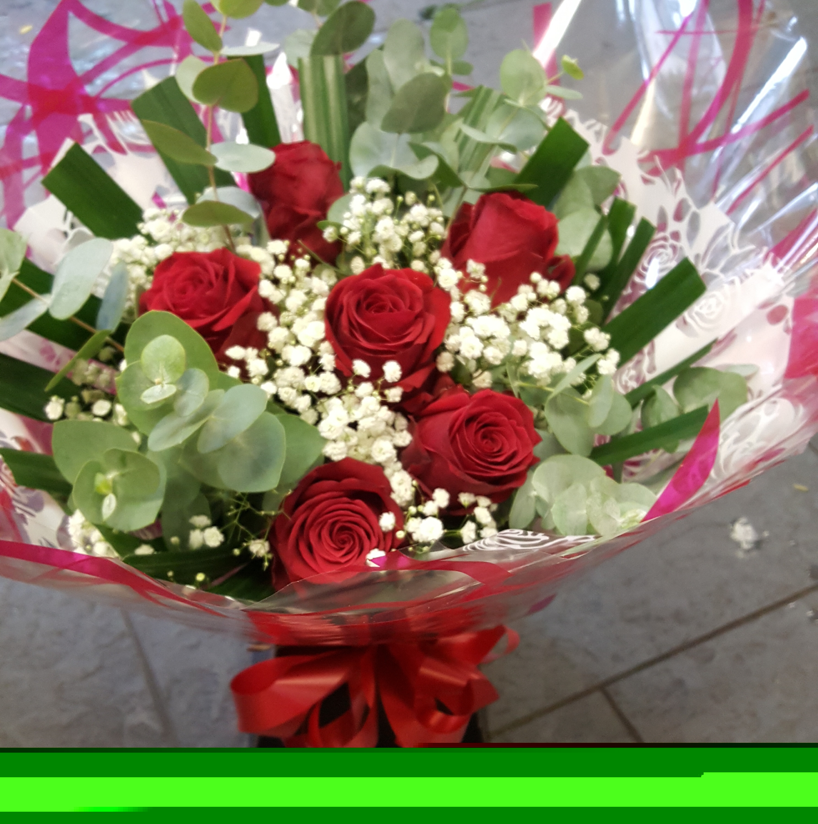 Six red rose,gypsophilia and foliage aqua bouquet