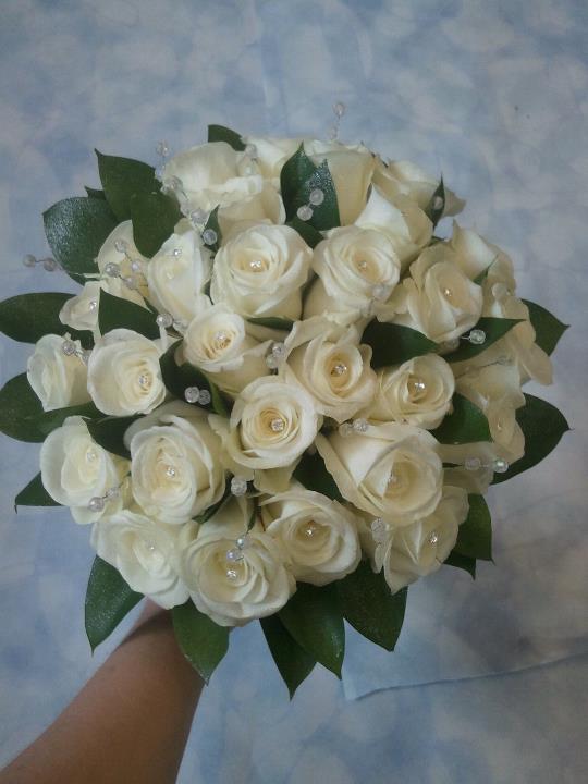 All rose and ruscus leaves trimmed with crystals and diamante